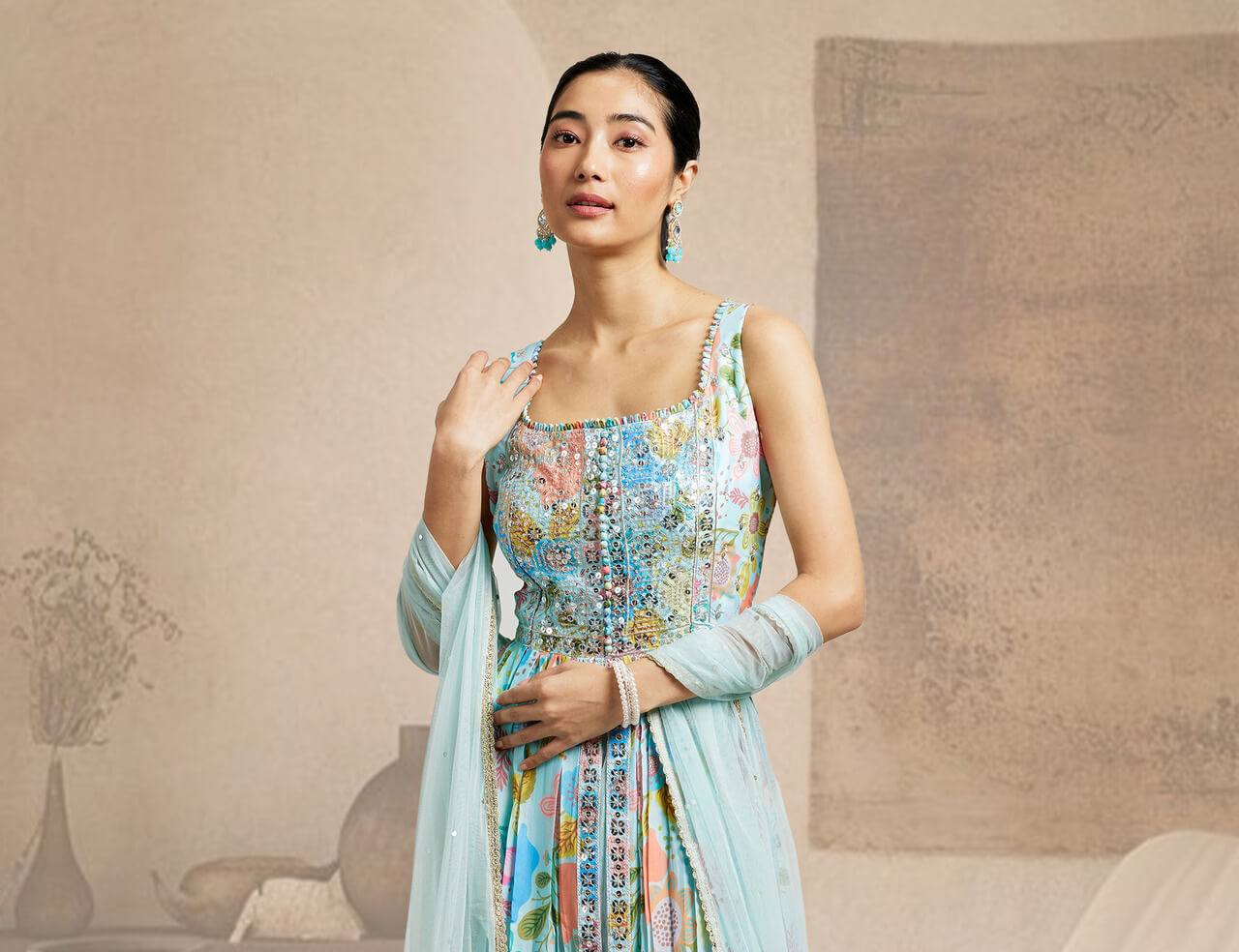 A lady wearing a lehenga and posing in a field