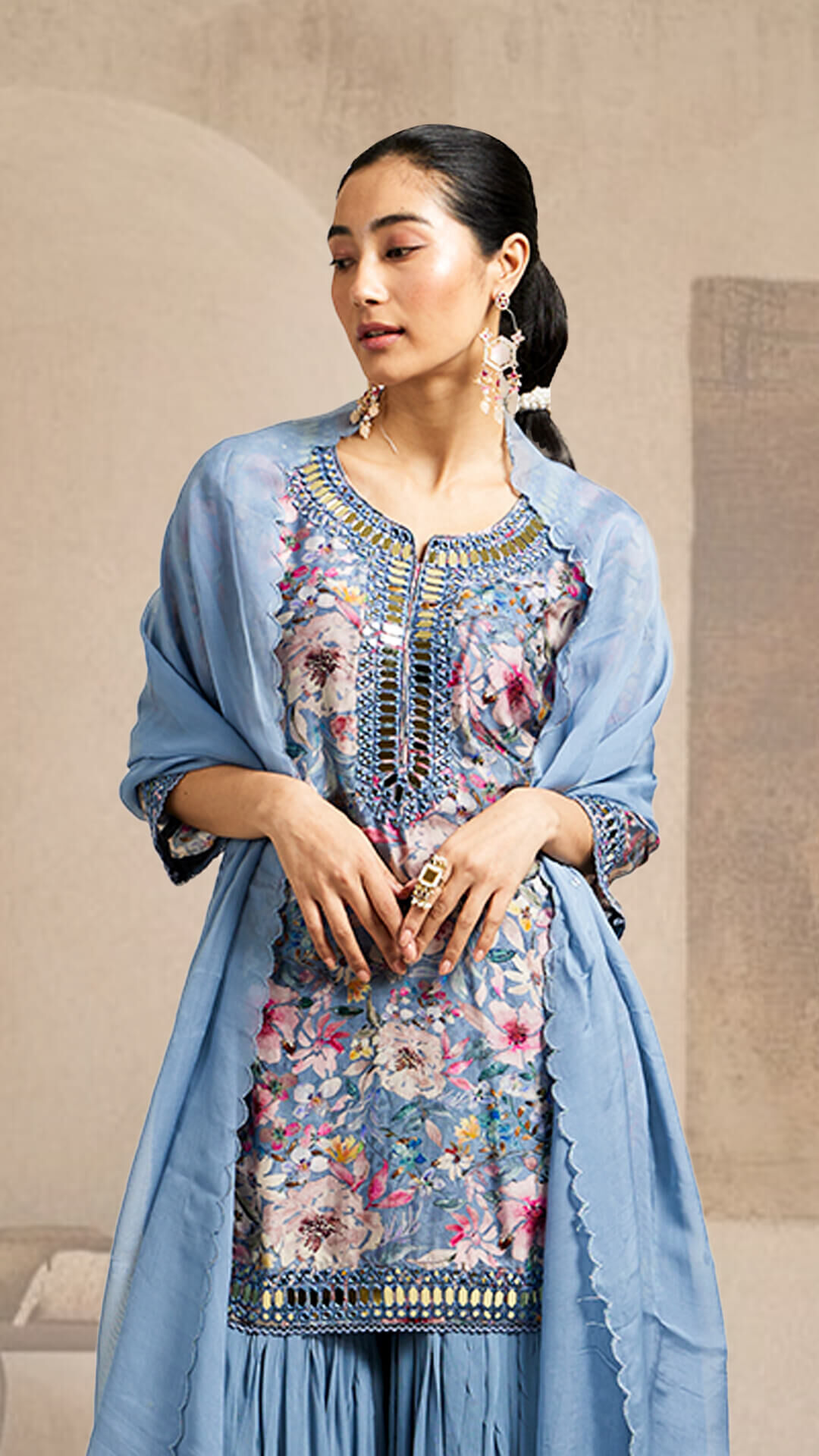 A woman wearing the dupatta in a side-sling style